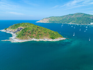 Fototapeta premium Drone aerial view shot of Tropical sea with beautiful small island in Phuket Thailand