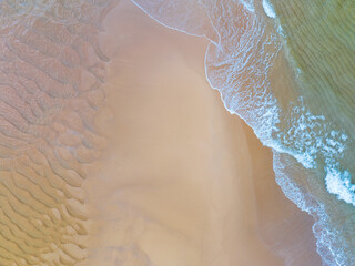 Top view of amazing pastel sand beach and turquoise sea copy space available nature background, High angle view sea sand background.