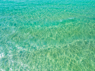 Sea surface aerial view,Bird eye view photo of green waves and water surface texture,Turquoise sea background, Beautiful nature Amazing view sea background