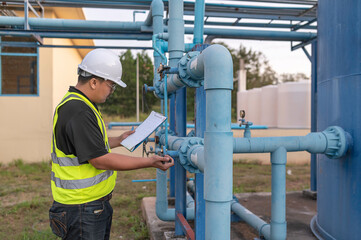 Environmental engineers work at wastewater treatment plants,Male plumber technician working at...
