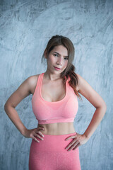 Close up asian beautiful sport girl on wall of gym,Thailand love health,Slim woman workout concept