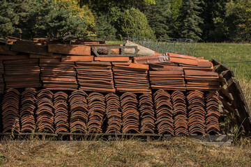 typical red roof tiles in the garden of a house in the French region of the Auvergne