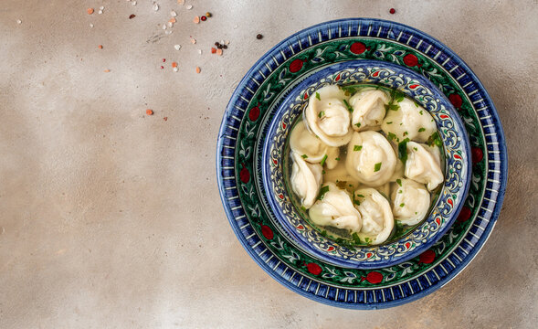 chuchvara dumplings with meat. Delicious uzbek dumplings. Manti with lamb meat. Uzbek cuisine, place for text, top view