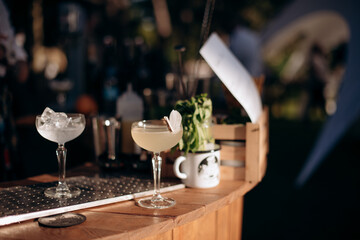 cocktail with ice and lemon on the bar counter