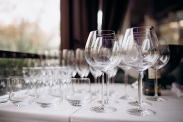 many empty clean shiny elegant glasses for alcohol