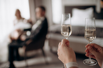bride and groom drinking champagne in the restaurant