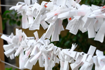 Omikuji , Omikuji is a small slip of paper that describes a person's future.