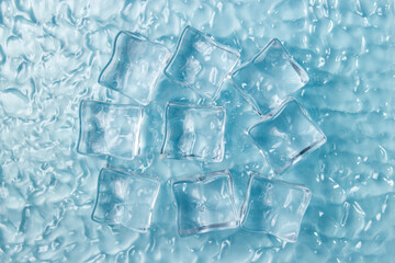 Ice cubes on the water on a blue background.