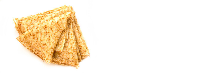Close up on a stack of folded crepes (french pancakes), isolated on white panoramic background, chandeleur web banner