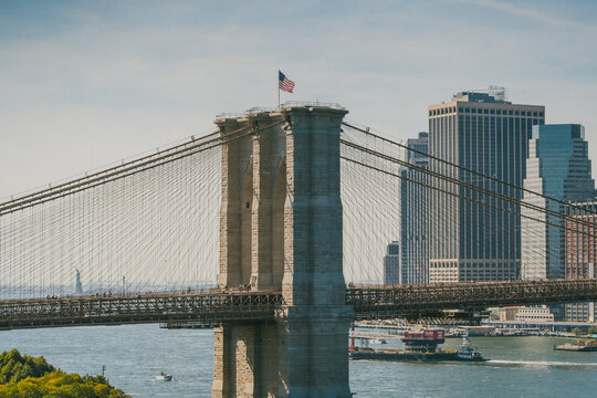 Bridge over river near modern buildings