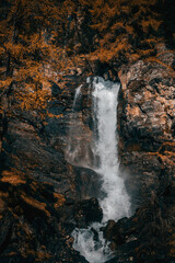 Fototapeta na wymiar waterfall in the mountains at autumn time