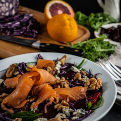 Smoked salmon tops a winter salad loaded with seasonal 