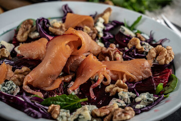 Smoked salmon tops a winter salad loaded with seasonal 