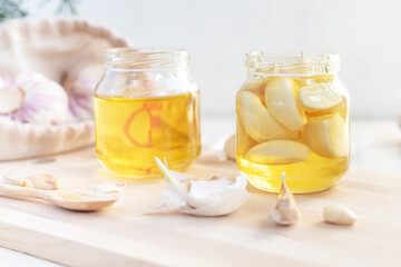 Fermented garlic cloves in a jar of honey. Healthy food and medicine from nature, honey for strong immunity, Fermented honey with garlic, a rich source of probiotics
