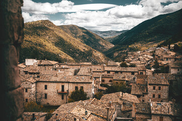 Panorama from the bell tower of the town and castle of Assisi in Italy on a cloudy day