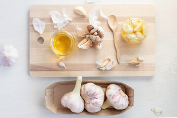 Fermented garlic cloves in a jar of honey. Healthy food and medicine from nature, honey for strong immunity, Fermented honey with garlic, a rich source of probiotics