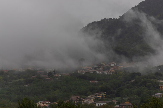 View of Santo Stefano del Sole on the hill with low clouds, Irpinia, Avellino, Campania, Italia.