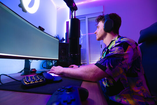 Focused man playing computer game