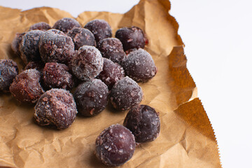 frozen cherries on craft paper