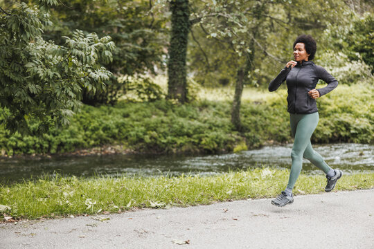 Black Woman Jogging In Nature