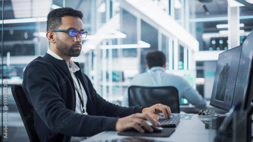 Poster Portrait of Multiethnic Industrial Engineer Developing 3D Model of a Circuit Motherboard on Computer CAD Software in a Factory. Modern Technological Research and Development Center.