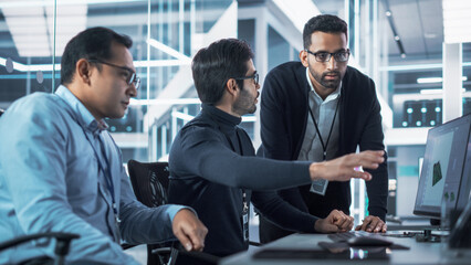 Team of Three Industrial Design Agency Specialists Discussing a 3D Circuit Board Model Created on a...