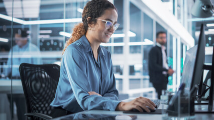 Portrait of a Beautiful Smiling Smart Industrial Engineer Working on a 3D Circuit Motherboard Project on Computer CAD Software in an Agency. Modern Technological Research and Development Office.