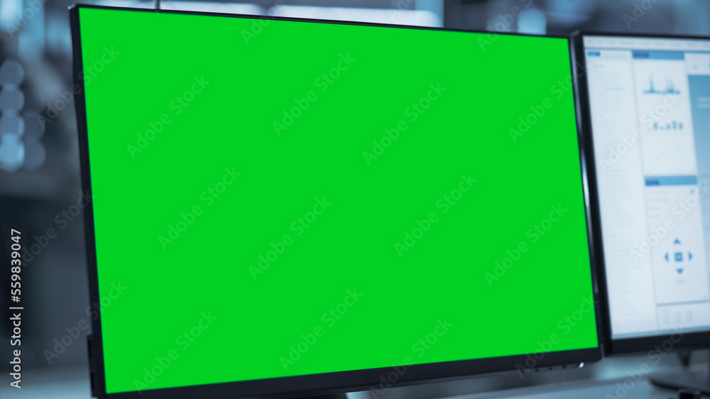 Poster Close Up of a Computer Monitor Display with Green Screen Chromakey Display Screen. Modern Factory Engineer's Office Concept.