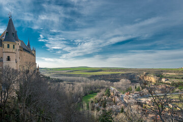 Fototapeta premium Views of the Alcazar of Segovia and the countryside at the end of the town on a winter day