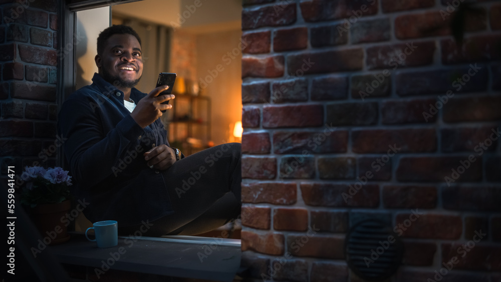 Aufkleber happy black man using smartphone to browse funny online content or chat with friends on social media