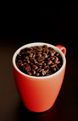 coffee beans in a cup on table