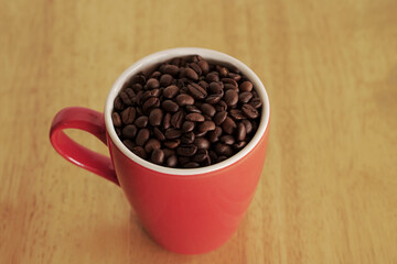 coffee beans in a cup on table
