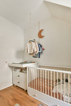 Crib and commode in bedroom