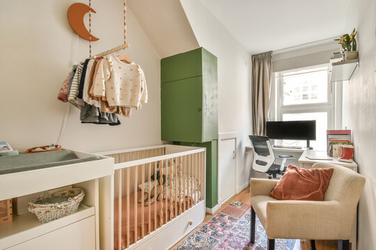 Crib and commode in bedroom