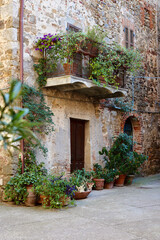 Fototapeta na wymiar Entrance of an old house in the Montemerano, Grosseto, Tuscany, Italy. 