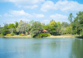 Green mountain hill with lake or river reflection. Nature landscape background, Thailand.