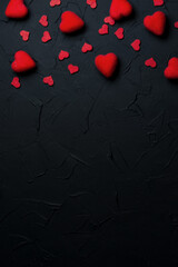 Vertical baner for Valentine's day. Black background with red hearts. Place for text.