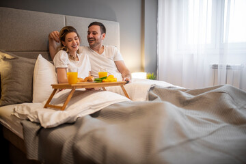 Obraz na płótnie Canvas Romantic breakfast for two in bedroom