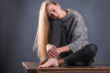 Full body portrait of a young beautiful blonde model