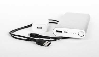 Portable phone charger, cable, USB plug, wire, cord. Travel kit for smartphone charging