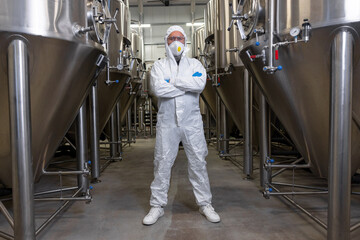 Brewer posing for the camera at the beer plant