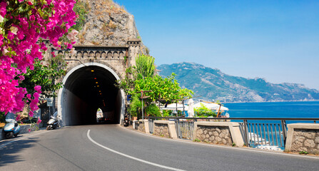 picturesque winding road of Amalfi summer coast and Tyrrhenian sea with flowers , Italy, web banner...