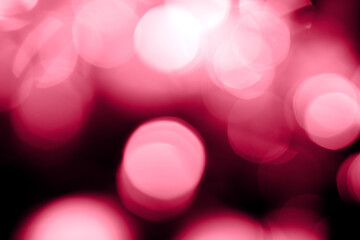 Viva magenta blurred lights abstract background. Holiday defocused bokeh