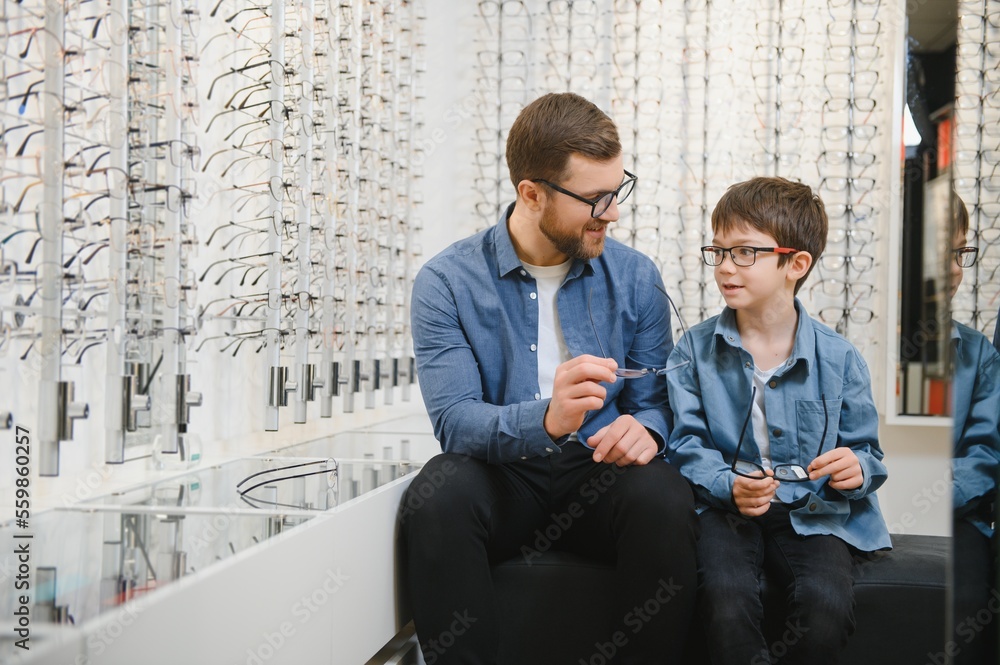 Wall mural family buy glasses. father in a blue shirt