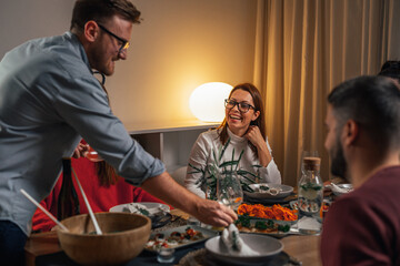 Host puts wine glass on the table for the guest