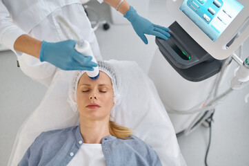 Closeup woman getting cosmetic procedure in beauty salon