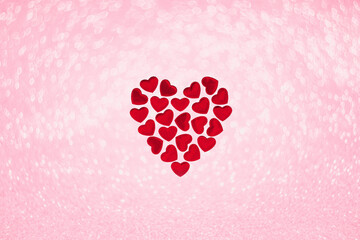 St Valentines day or thank you concept. Many magenta red hearts form one bigger heart shape flat...
