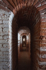 Light at the end of the tunnel. A brick tunnel.