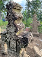 Fototapeta na wymiar selective focus photo of lampulo ancient tombstone grave of aceh kingdom admiral