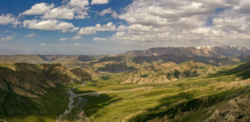 Fototapeta na wymiar beautiful green mountains, river, hills. View from above. Kazakhstan